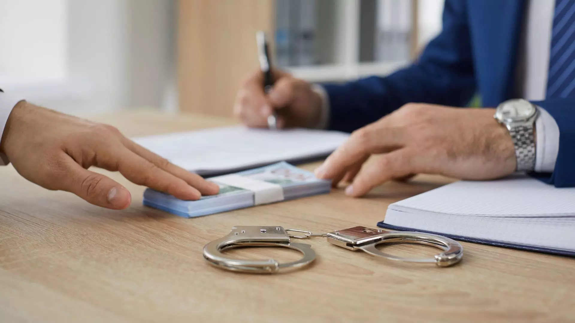 Bail agent with client in an office.